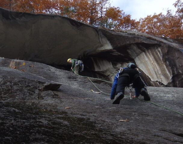 A woman climbing a cliff in Connecticut