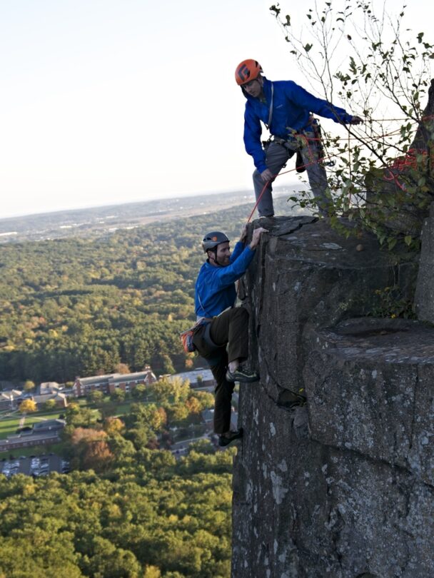 A woman climbing a cliff in Connecticut