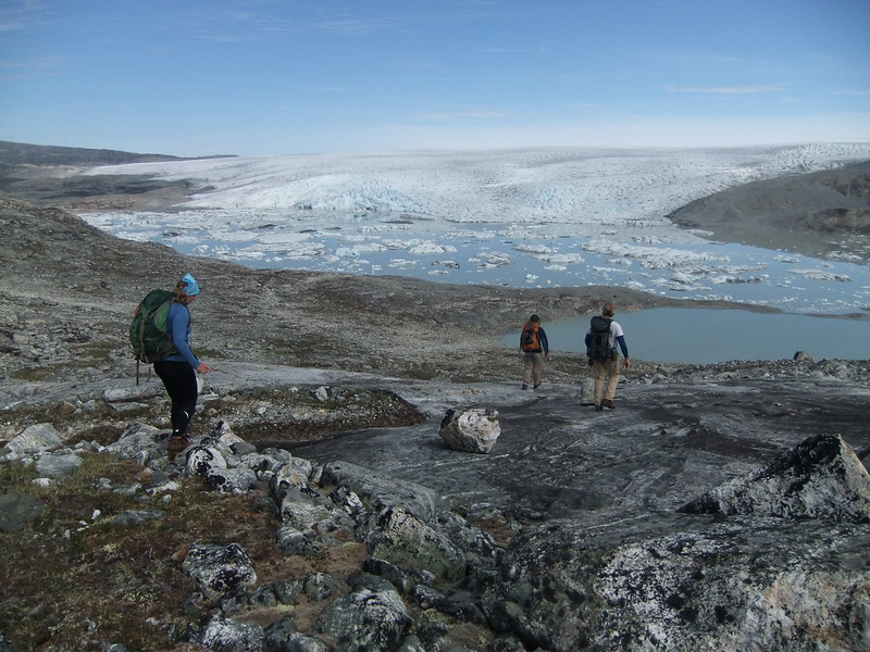 Some hikers descending from a cliff in Greenland
