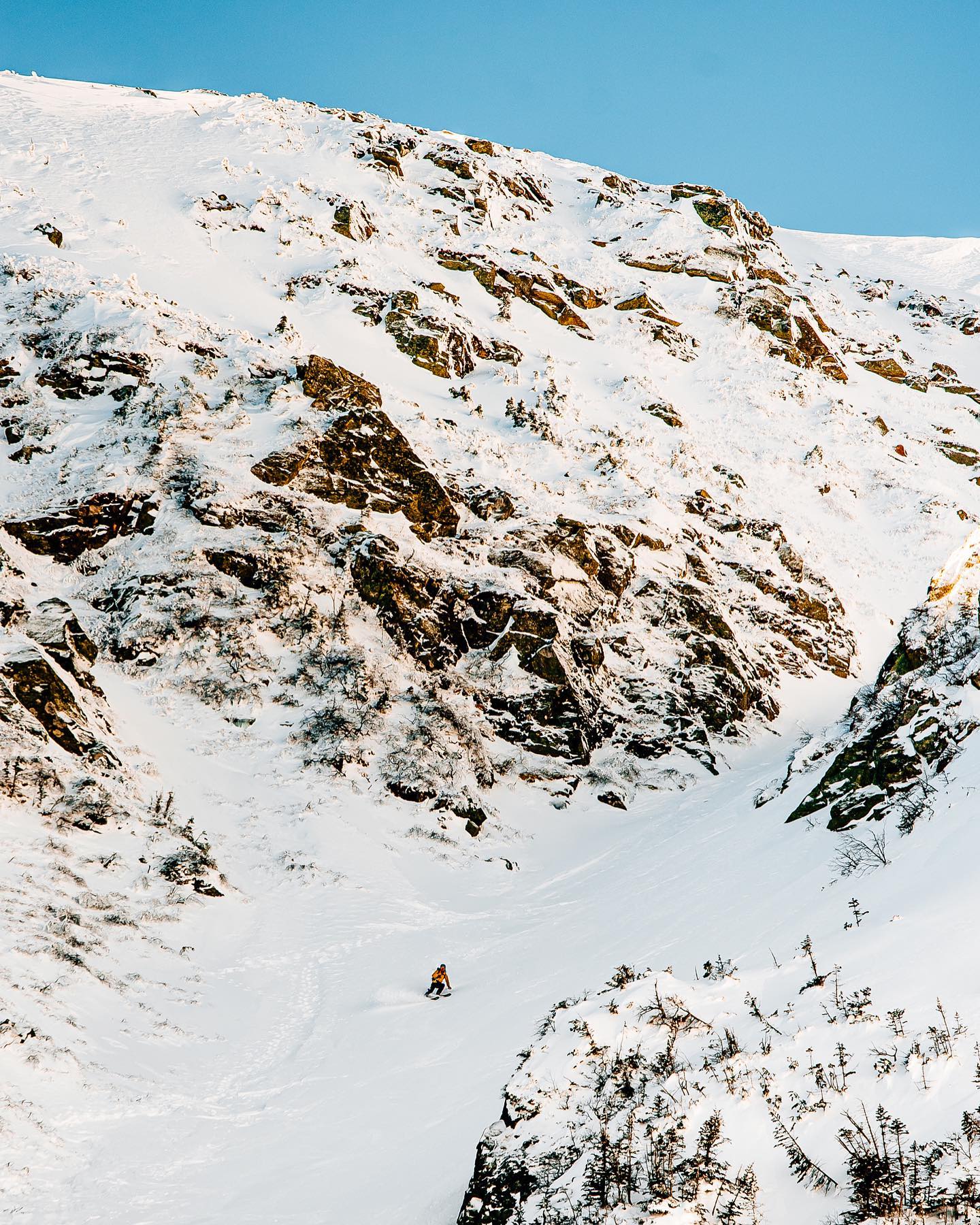A mountain and a boarder in New Hampshire