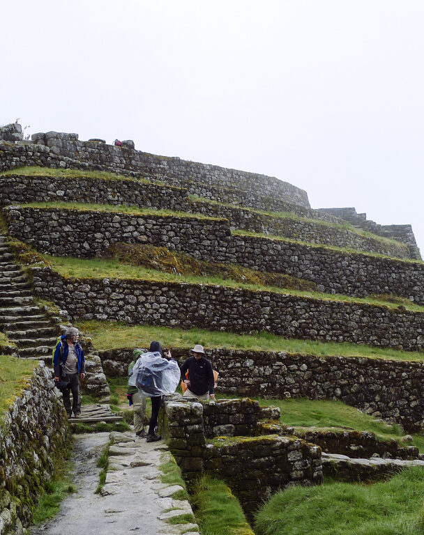 Woman standing in front of Machu Picchu
