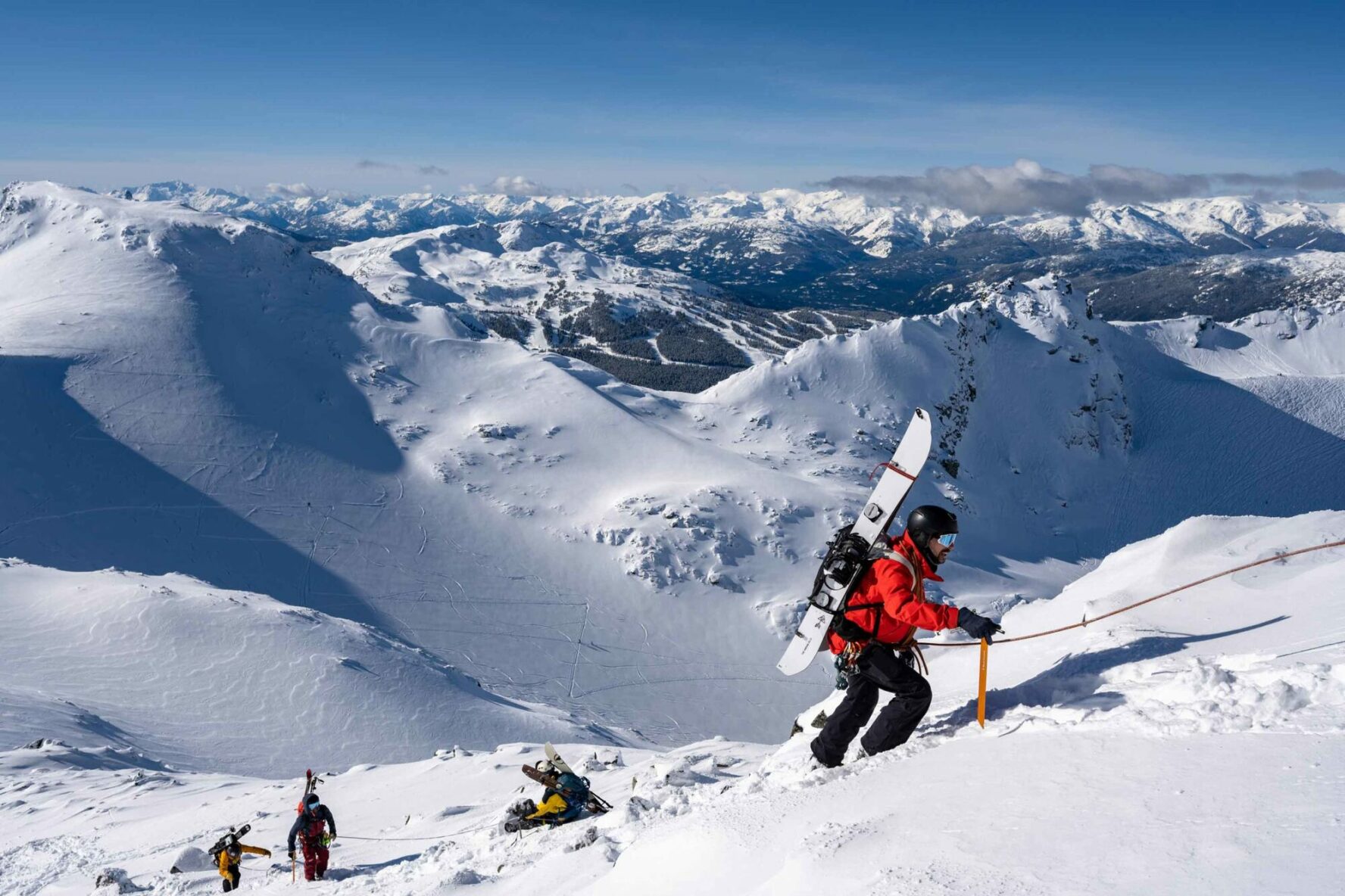 A mountaineer following a rope in the Coast Mountains