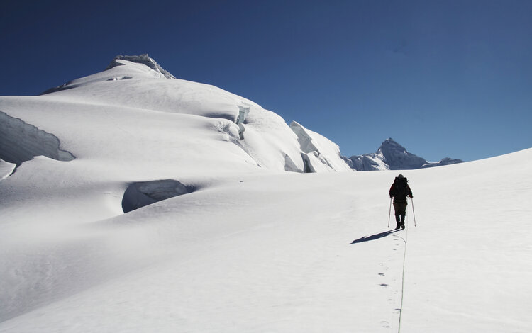 A hiker on a slope in the Cordillera Blanca