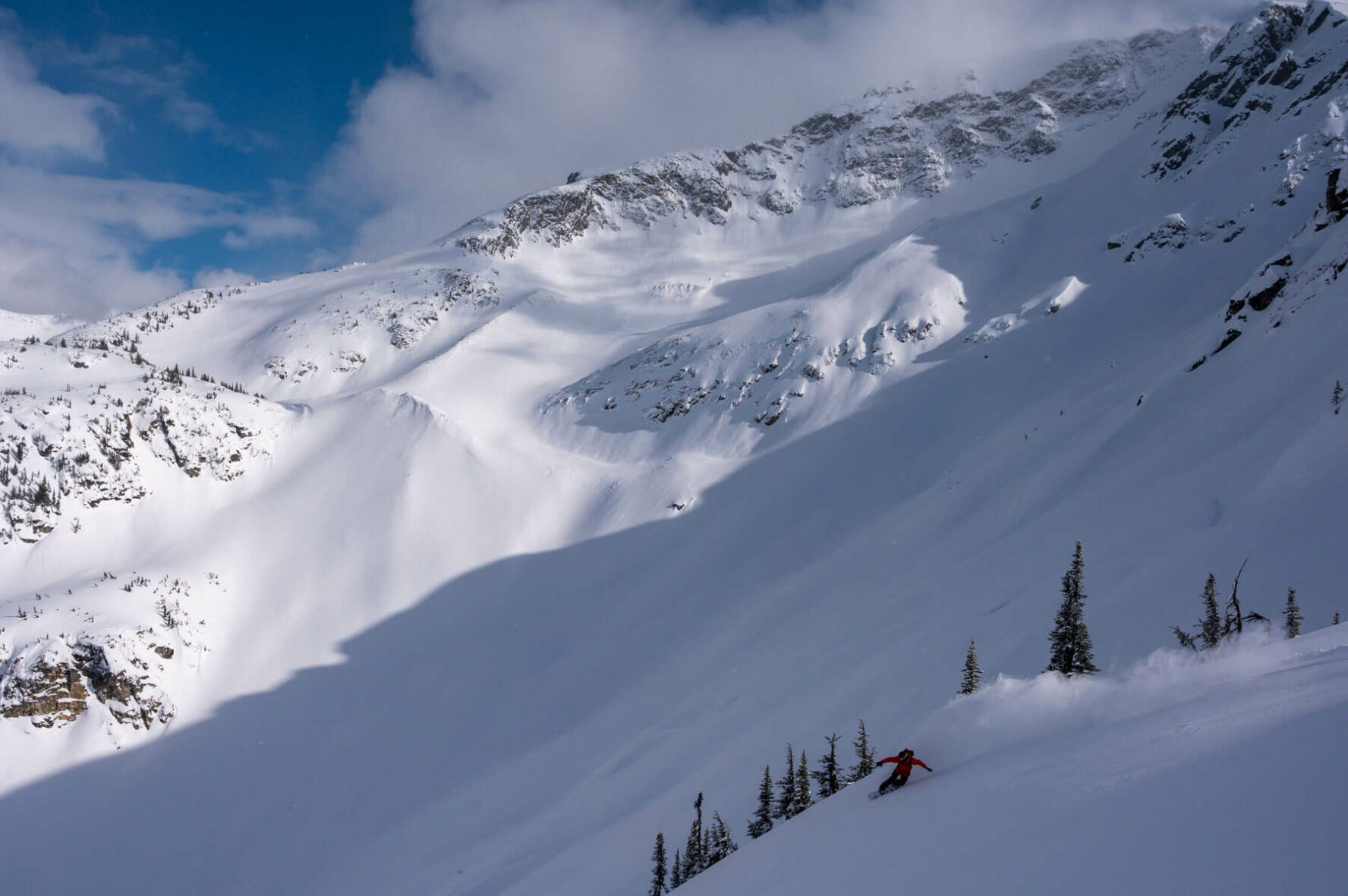 A skier going downhill on a ski tour