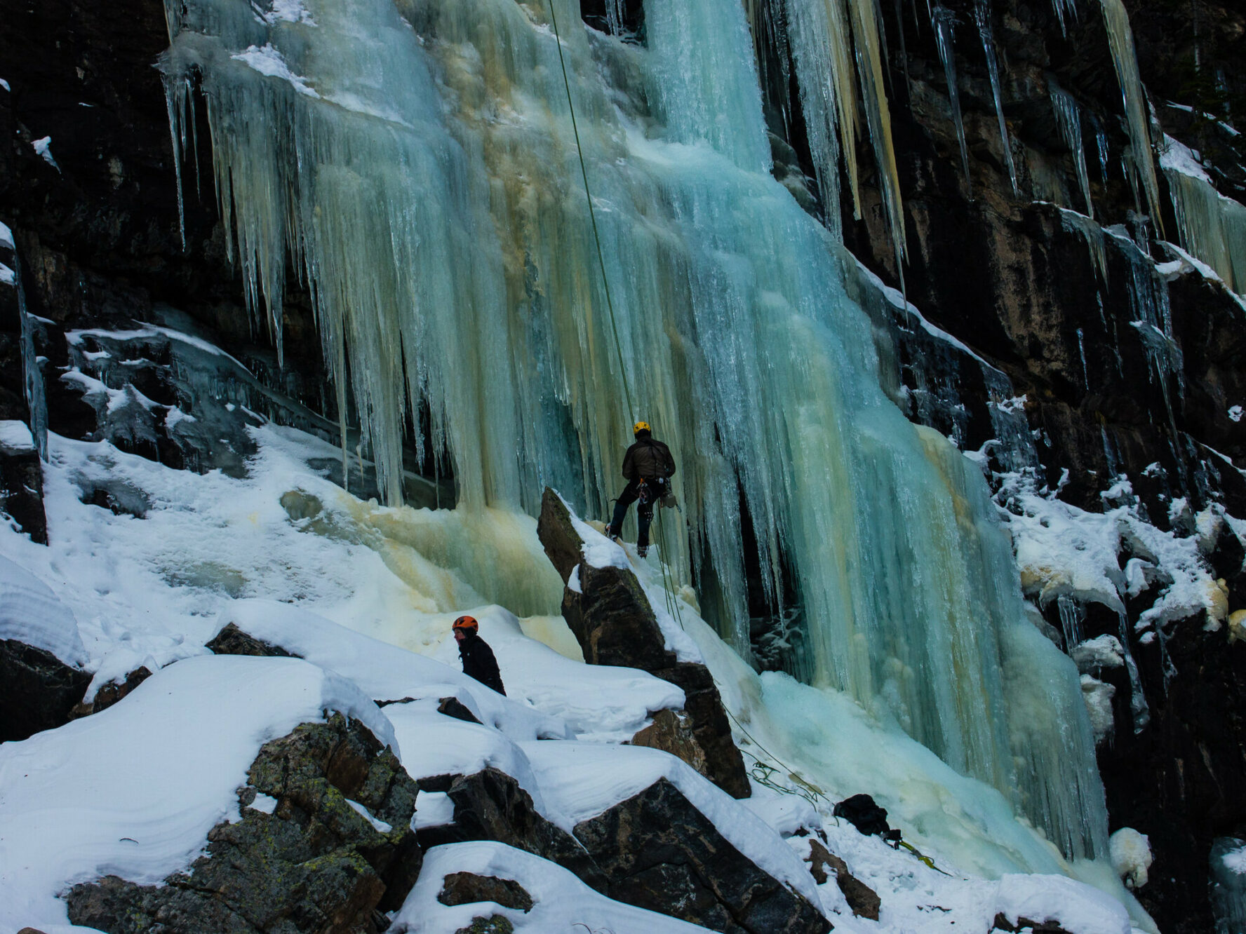 Climbers waterfall rappelling in Rocky Mountain National Park