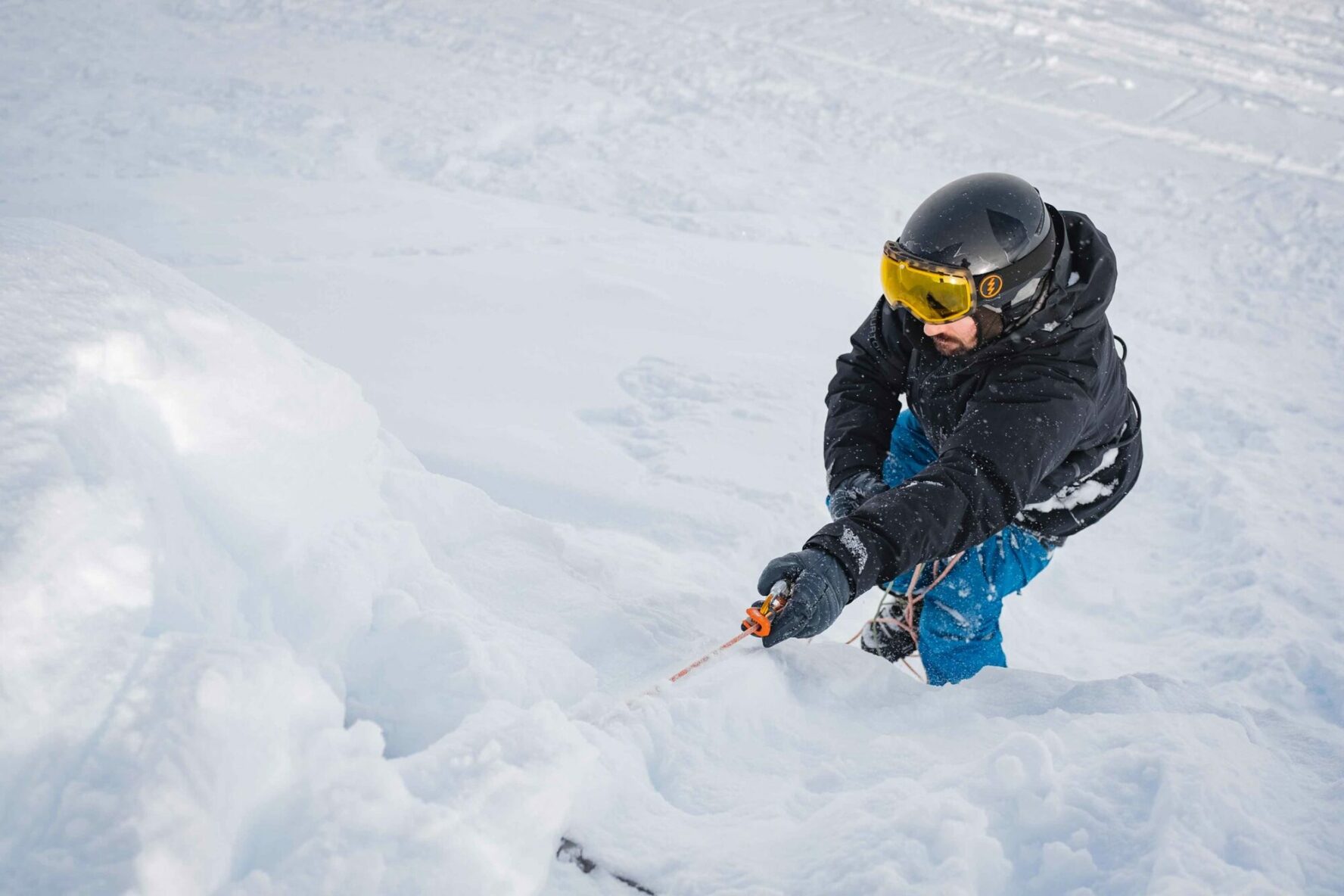 A skier practicing crevasse descents in Whistler