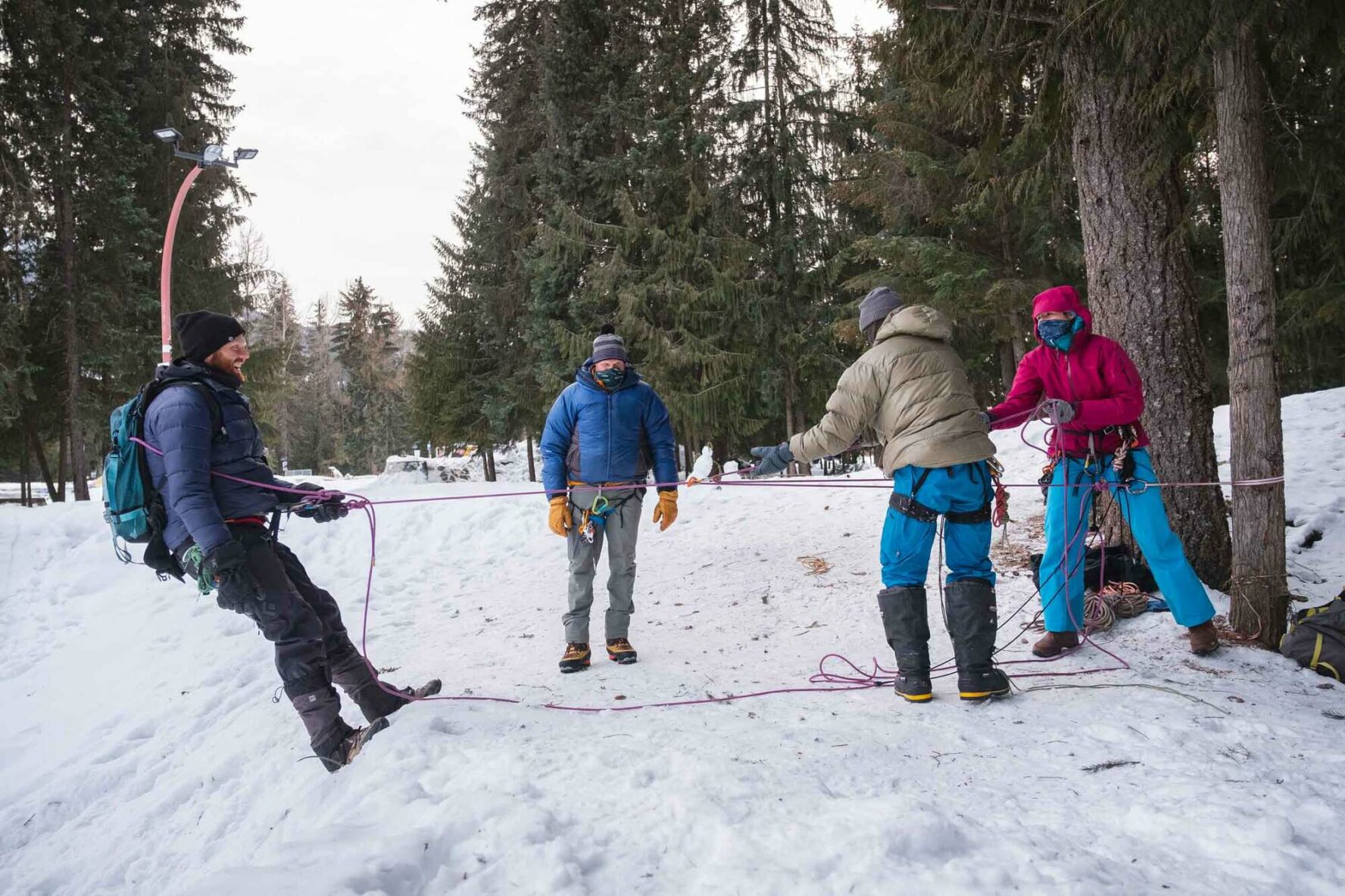 Skiers practicing rope use in British Columbia