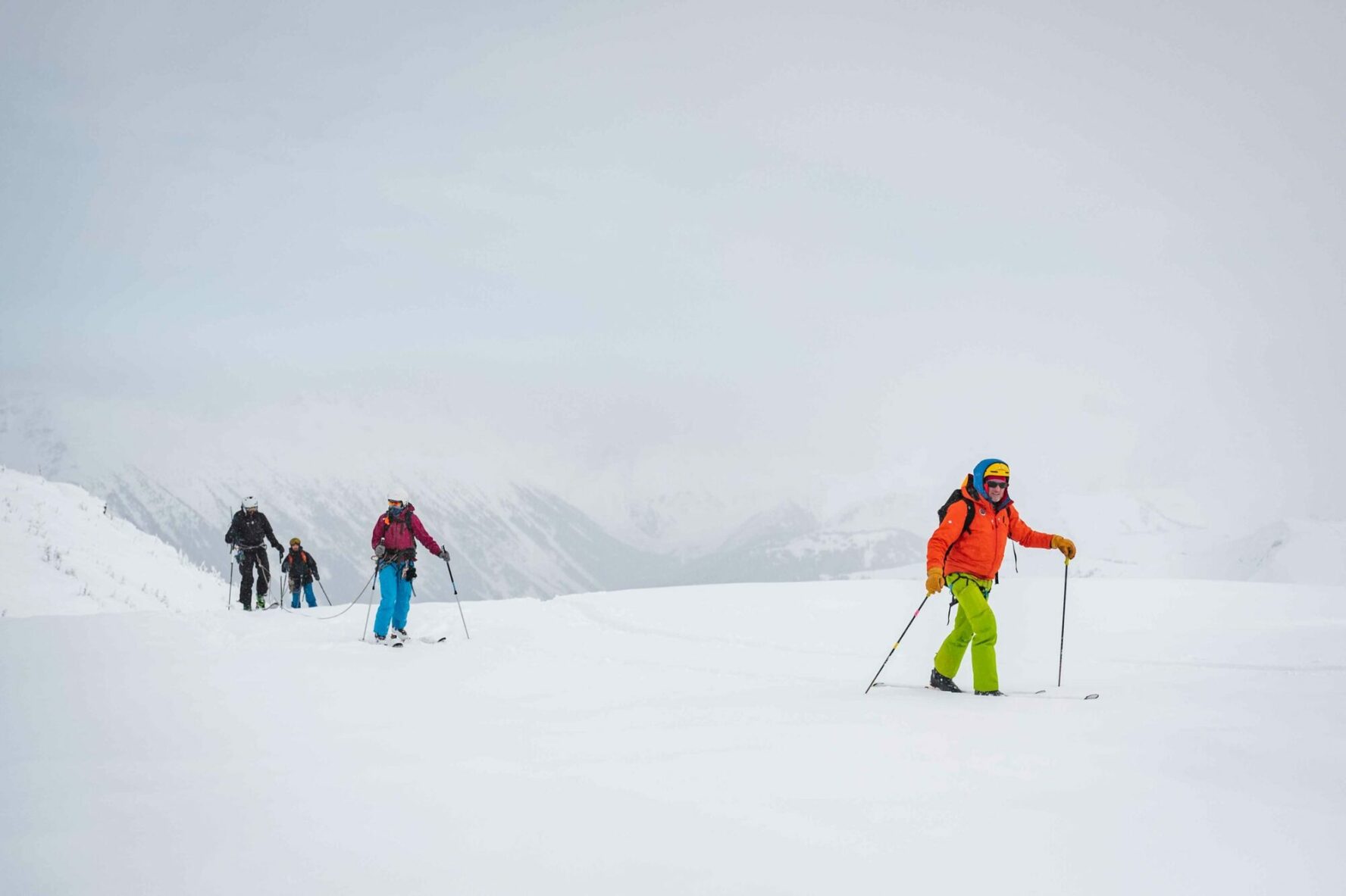 Skiers traversing a slope in British Columbia