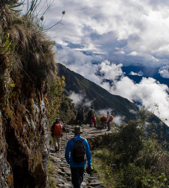 People hiking over a pass on the Inca trail
