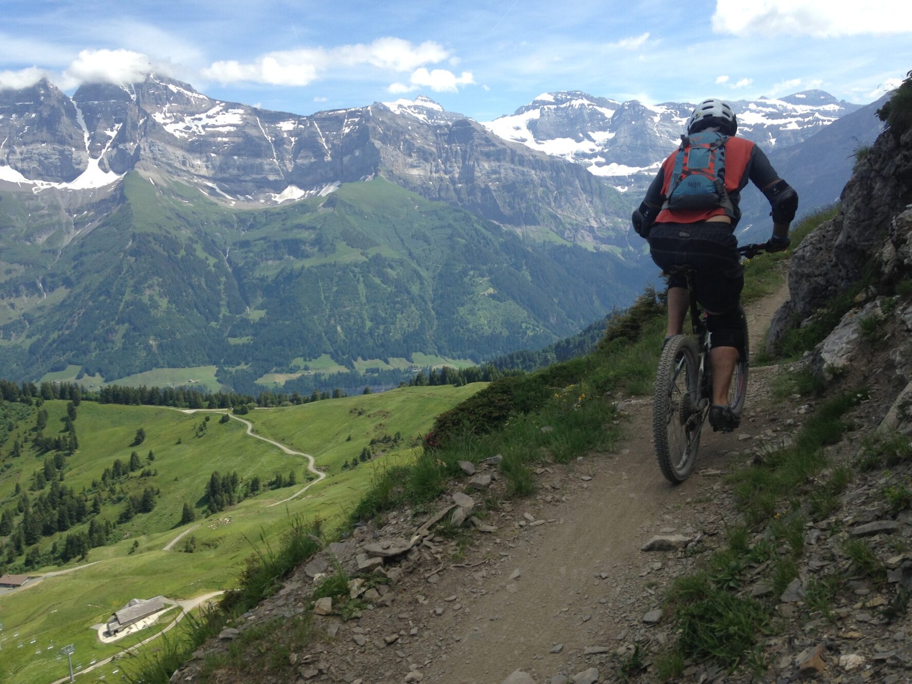 Mountain biking in the Alps behind a friend on the Pass’Portes du Soleil near Morzine.