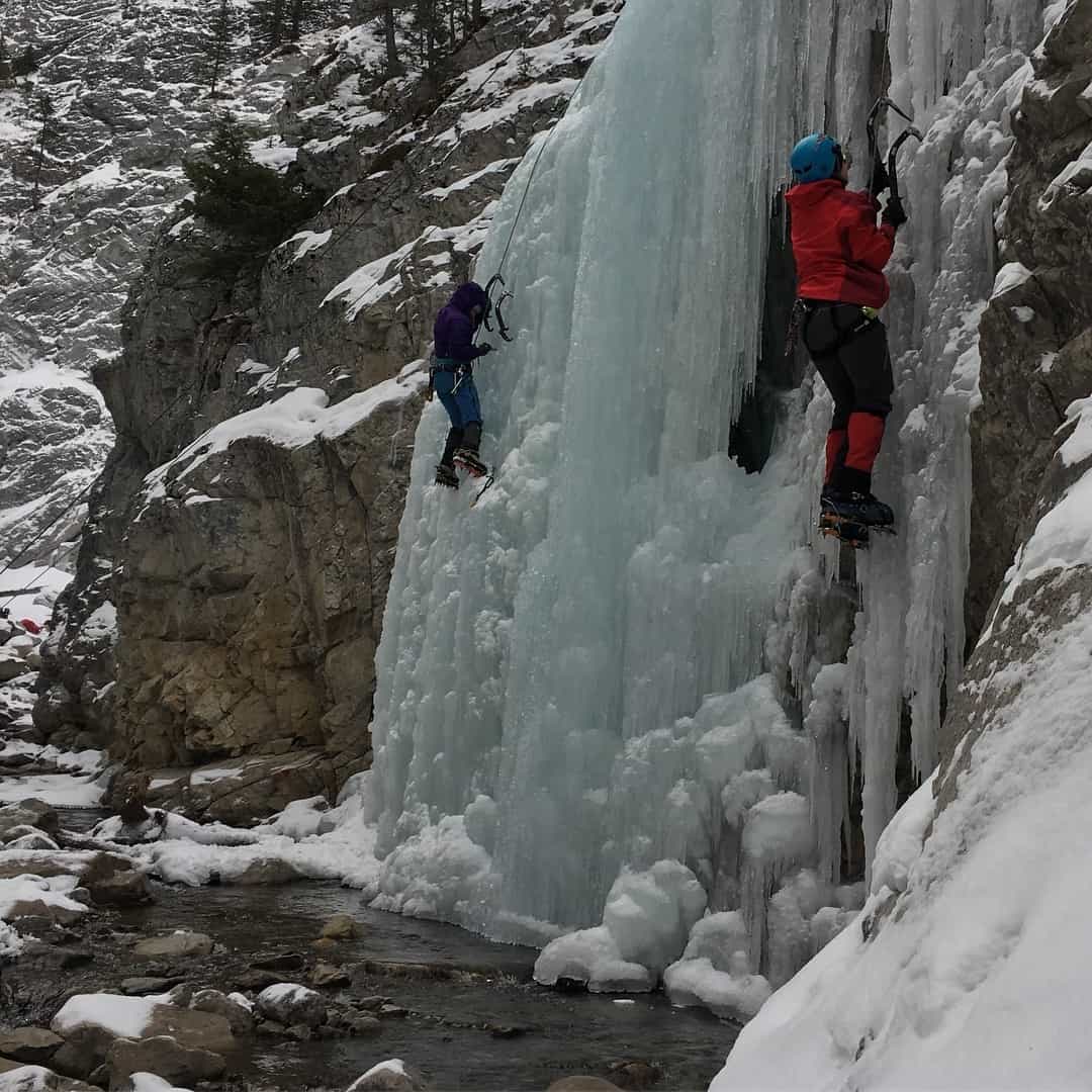 Ice climbers on a crag in the Canadian Rockies