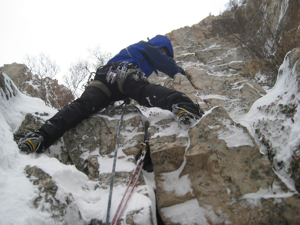 A climber performing mixed climbing