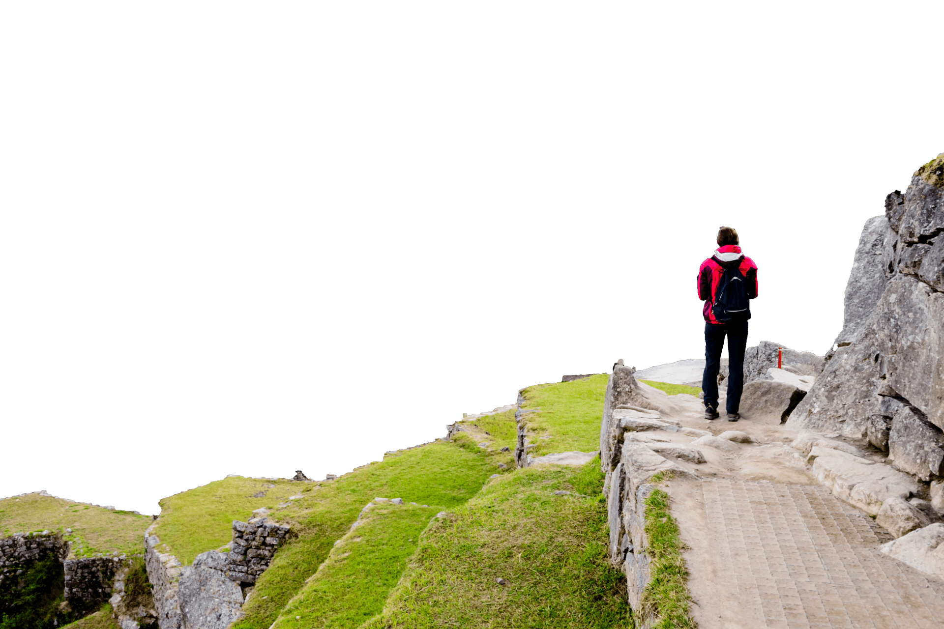 A hiker overlooking Machu Picchu site.