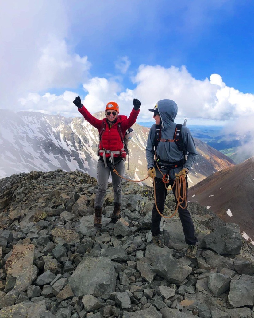 Mountaineers celebrating a climb on Wilson Peak, Uncompahgre