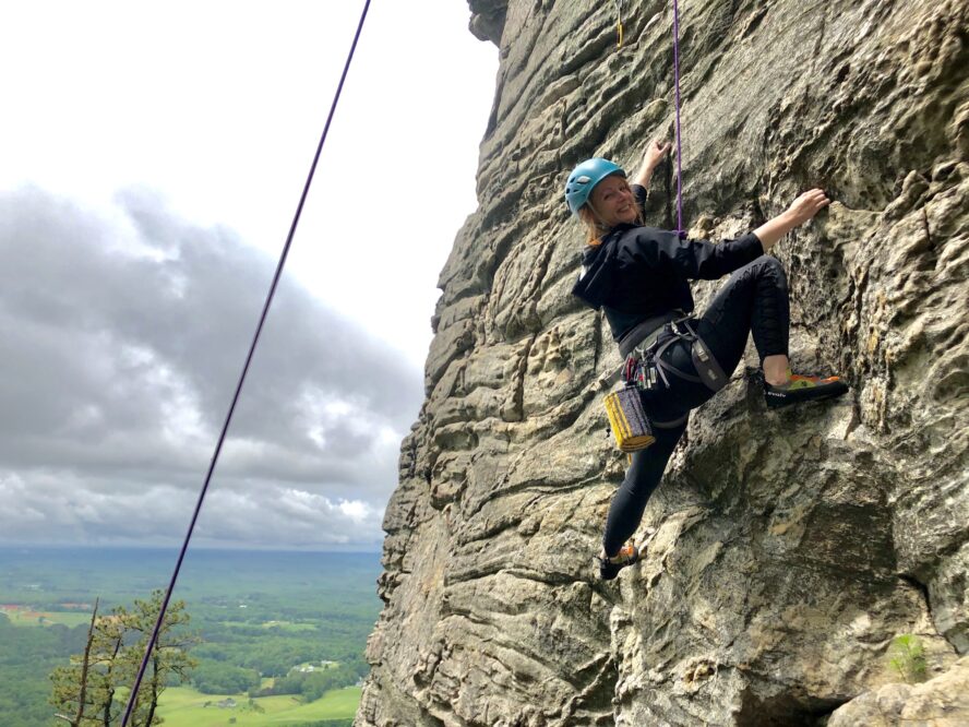 Top roping the south facing quartzite cliffs that define the Pilot Mountain climbing area in the Piedmont region of North Carolina