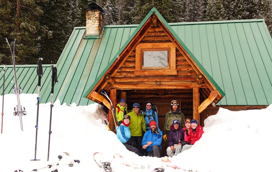 Climbers gathered outside of the Stanley Mitchell Hut on the Bow-Yoho Traverse.