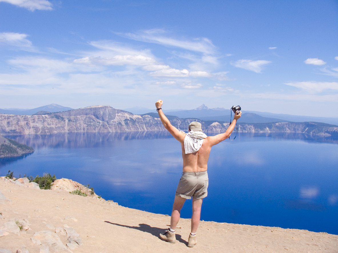 A hiker on a vantage point in the Crater Lake National Park