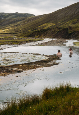 Many hikers in Iceland decide to soak in a geothermal pool surrounded by mountains and sheep peacefully grazing next to our clothes.