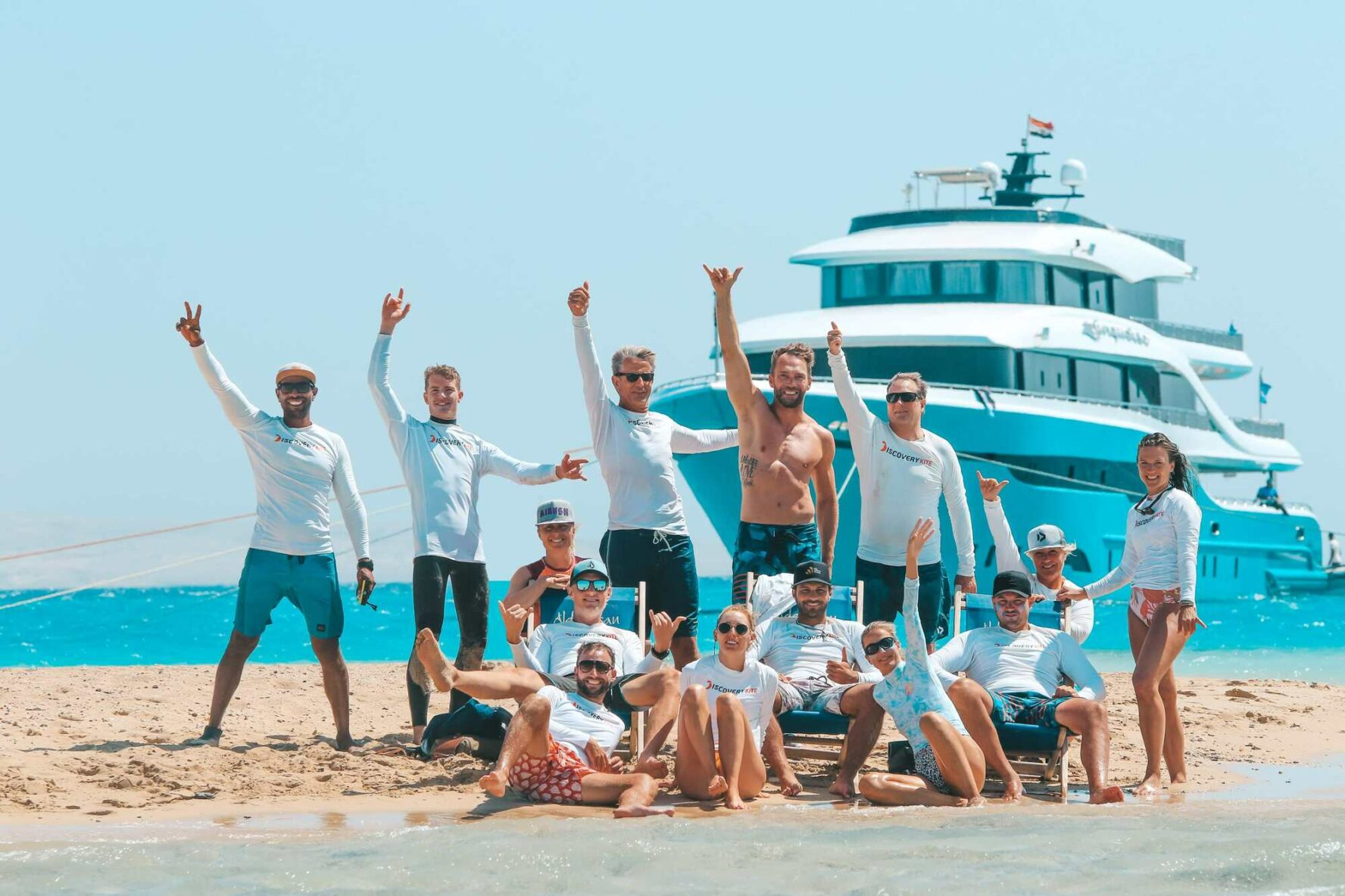 A group photo of kitesurfers on an island in the Red Sea