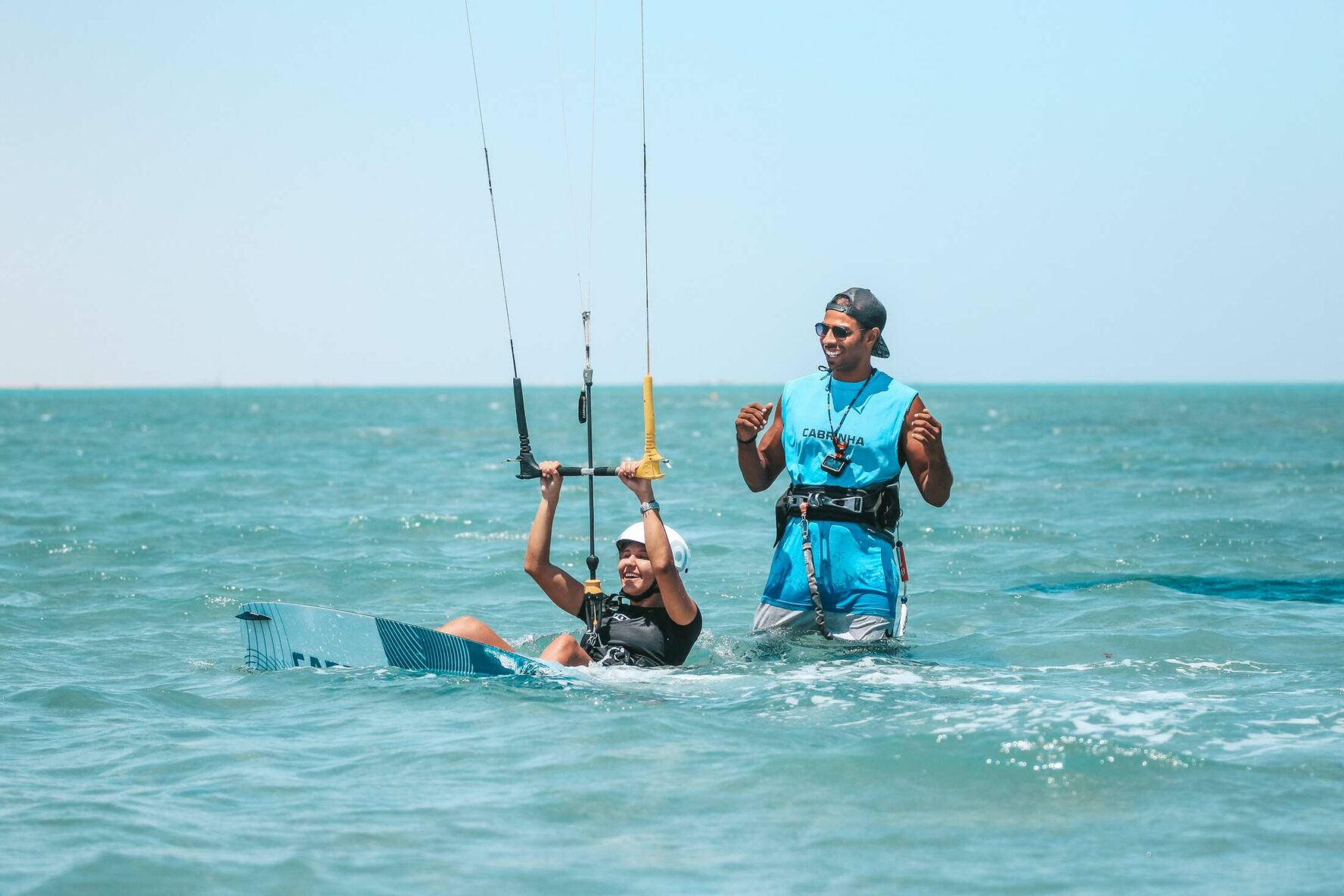 A guide and a kitesurfer working on kitesurfing skills in El Gouna