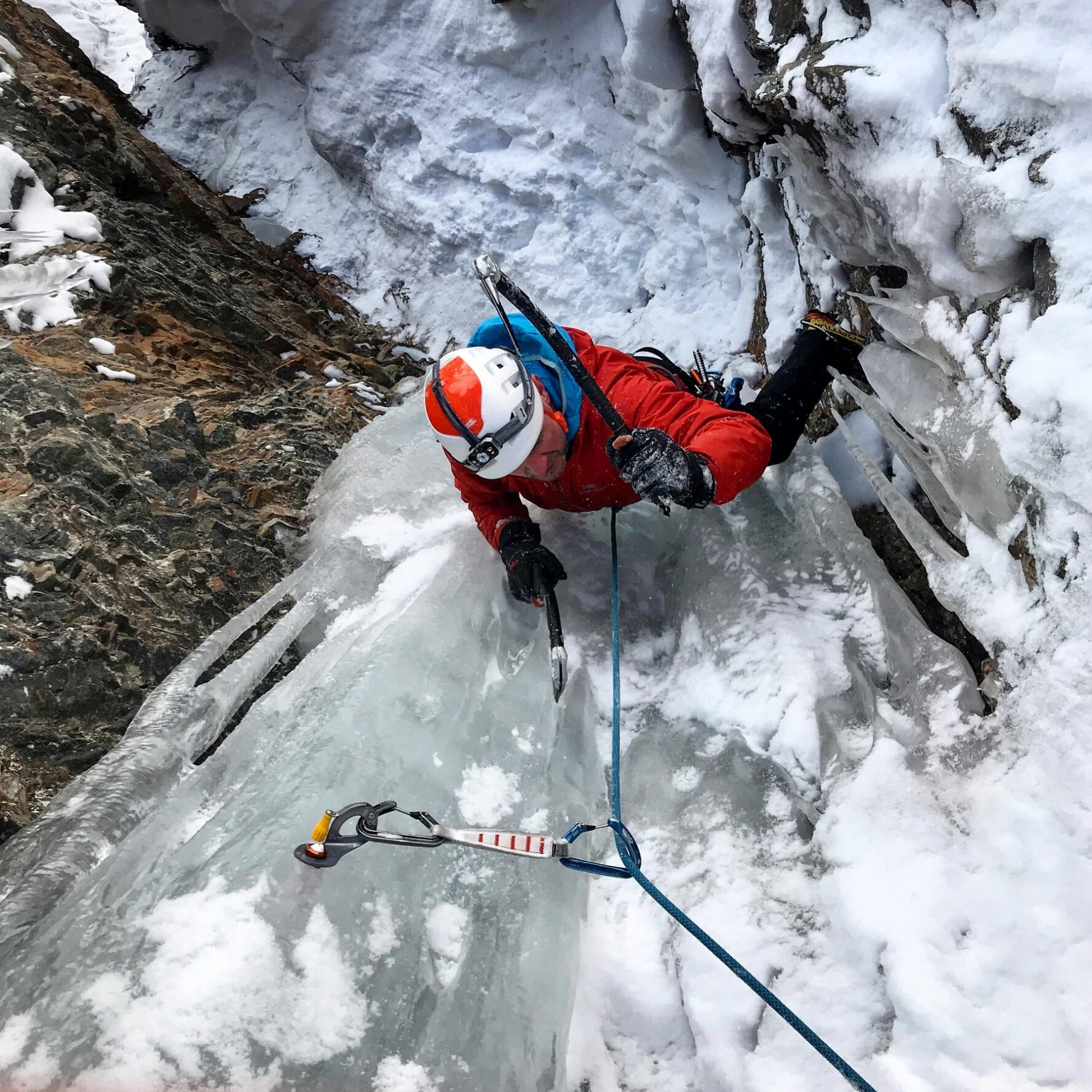 An ice climber climbing in Ouray, Colorado
