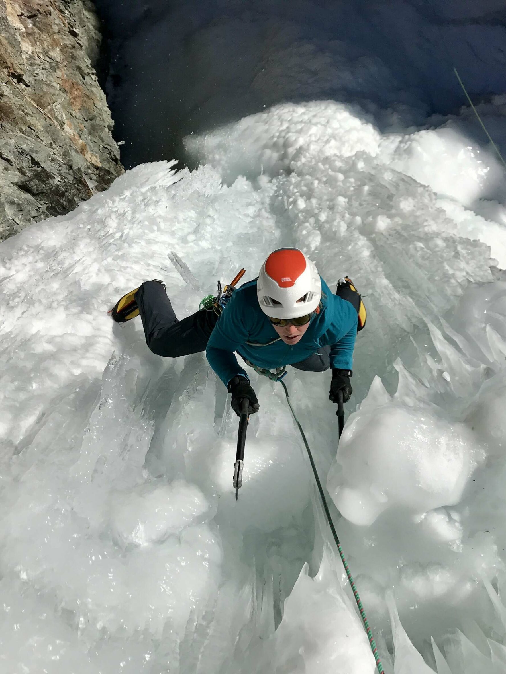 Ice climber on a majestic frozen structure
