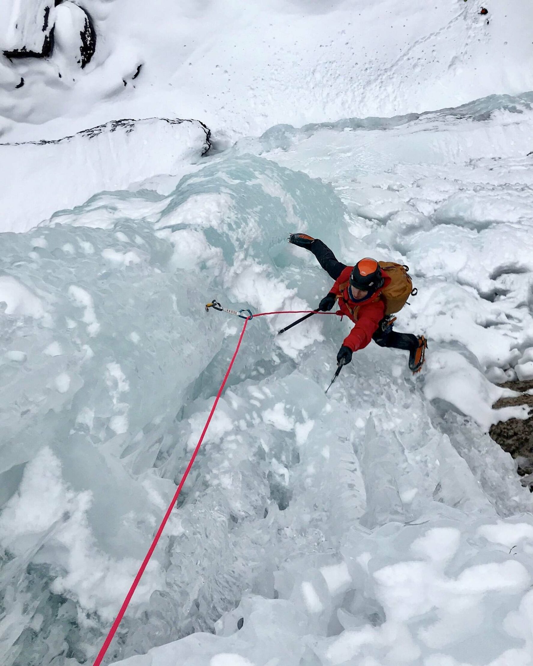 An ice climber on a frozen structure in Ouray