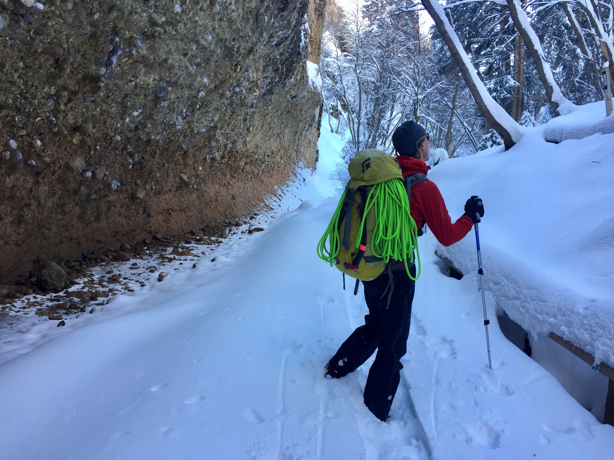An ice climber marveling at the surrounding scenery in the Wasatch Mountains