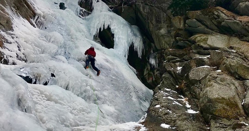 A person ice climbing in the Wasatch Mountains