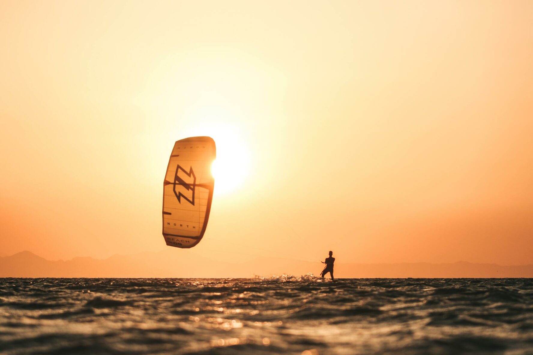 Kitesurfer and a beautiful orange sky in El Gouna