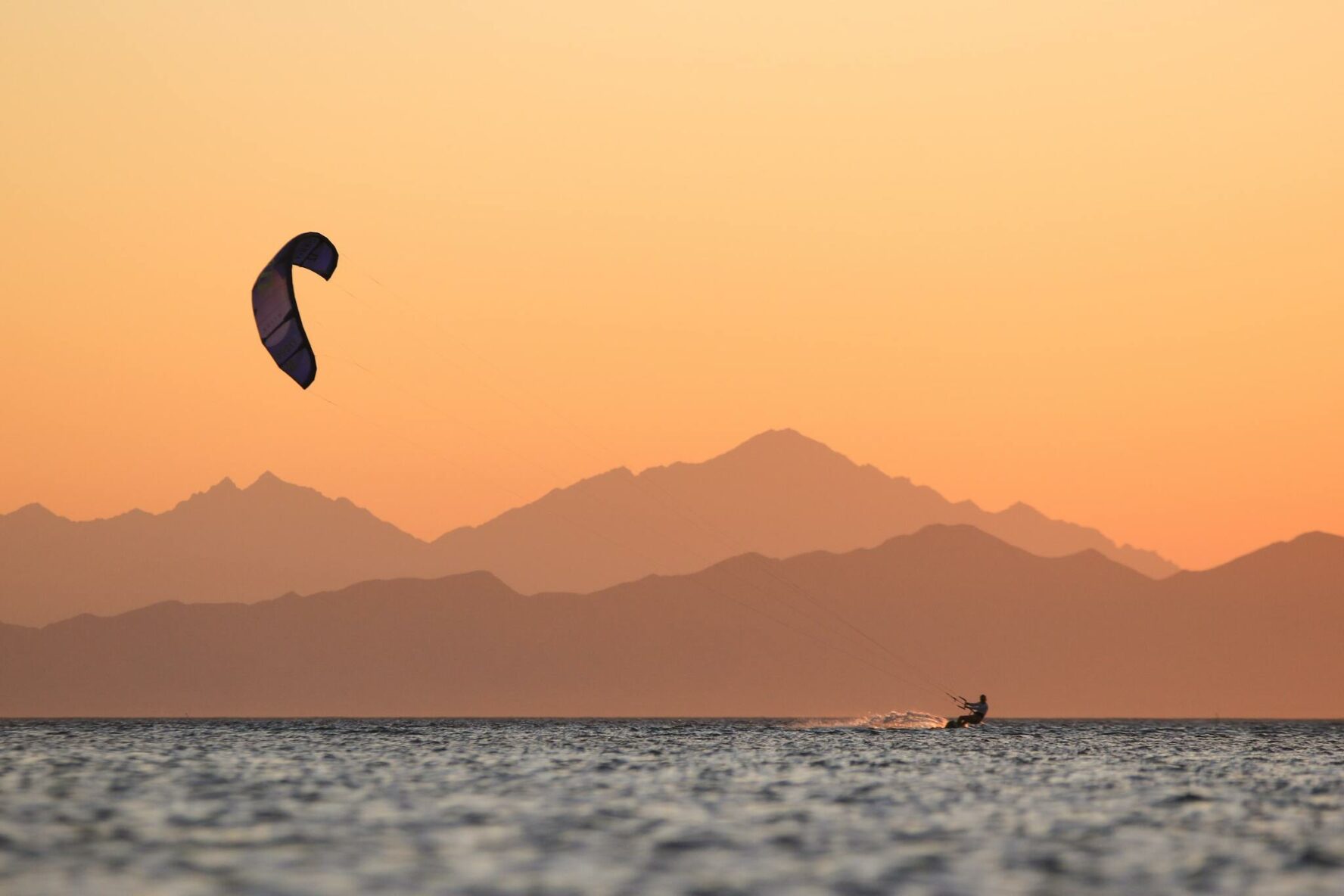 A kitesurfer and an orange sky in Hurghada