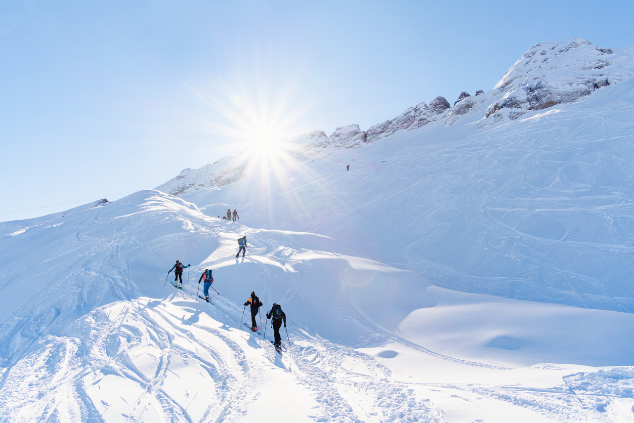 ski tourers ascending a slope on the Marmolada glacier