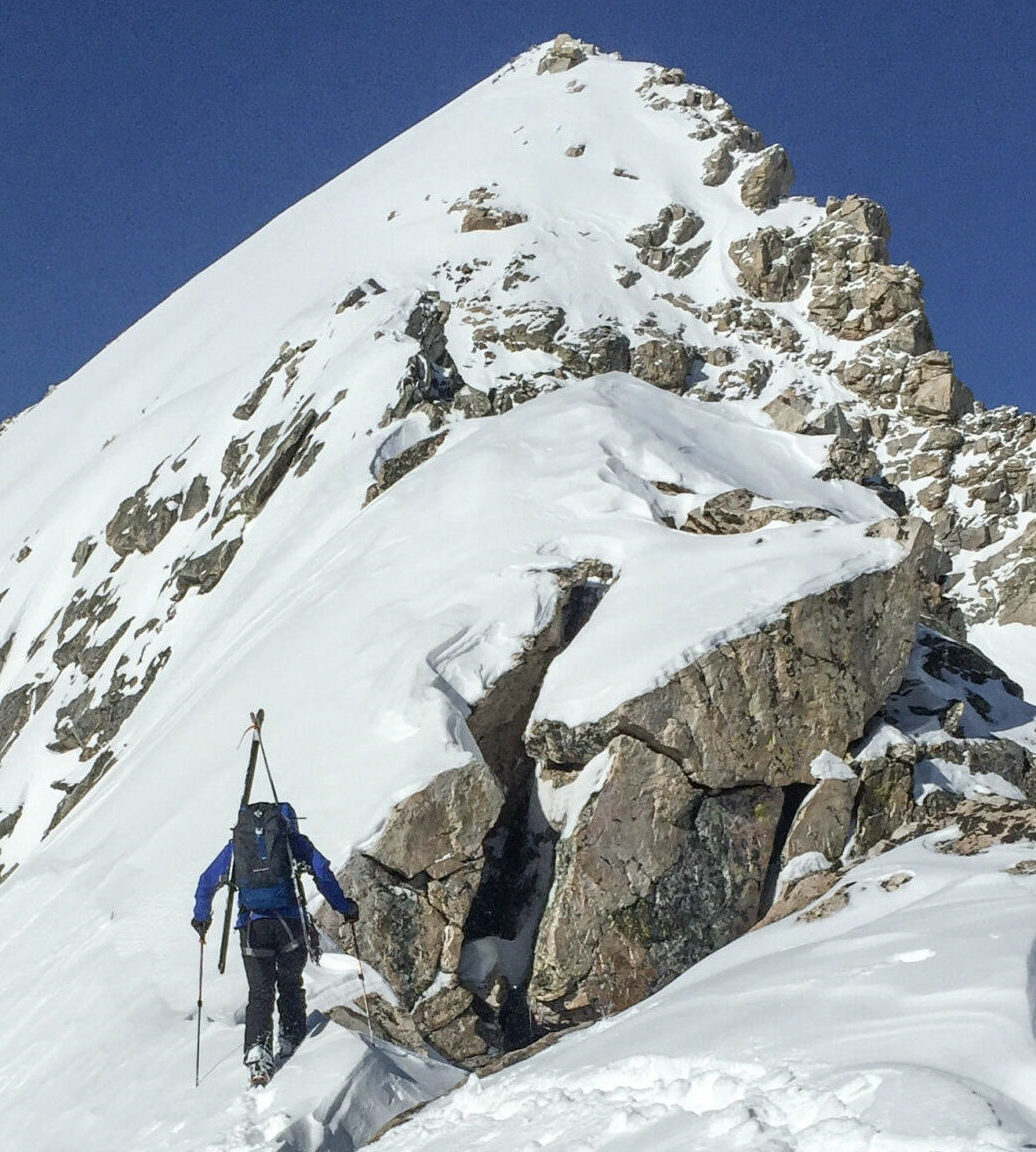A person ski mountaineering in the Tetons.