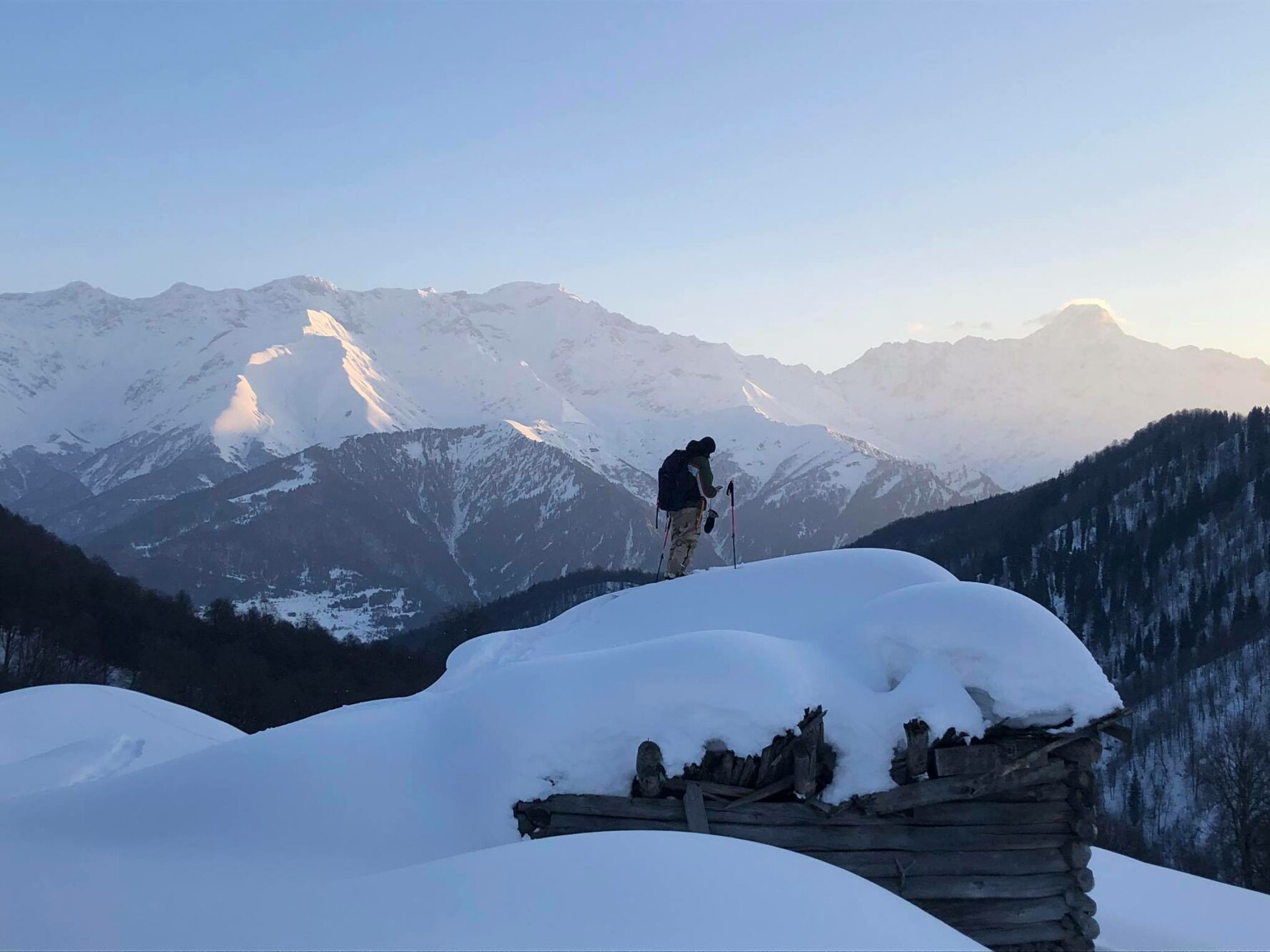 A skier admiring the scenery in Racha