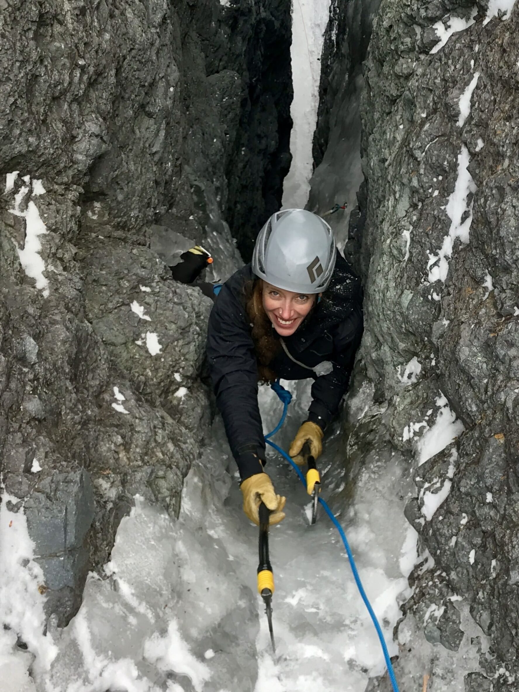 A woman ice climbing in Colorado