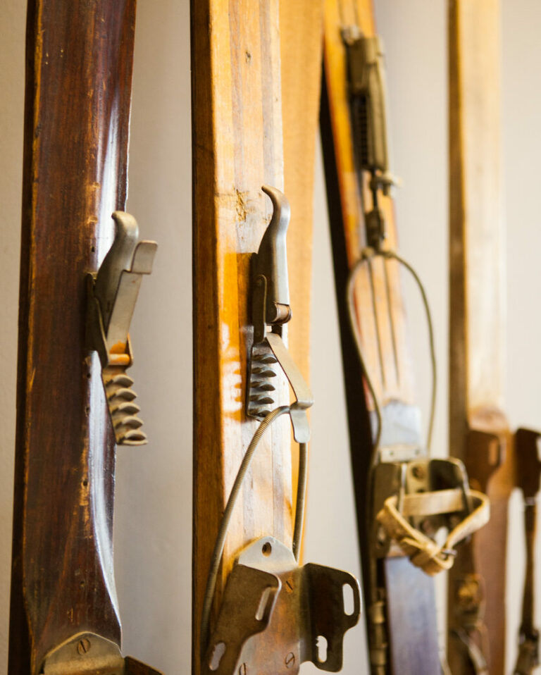 Close up of shoe clips of some very old wooden skis
