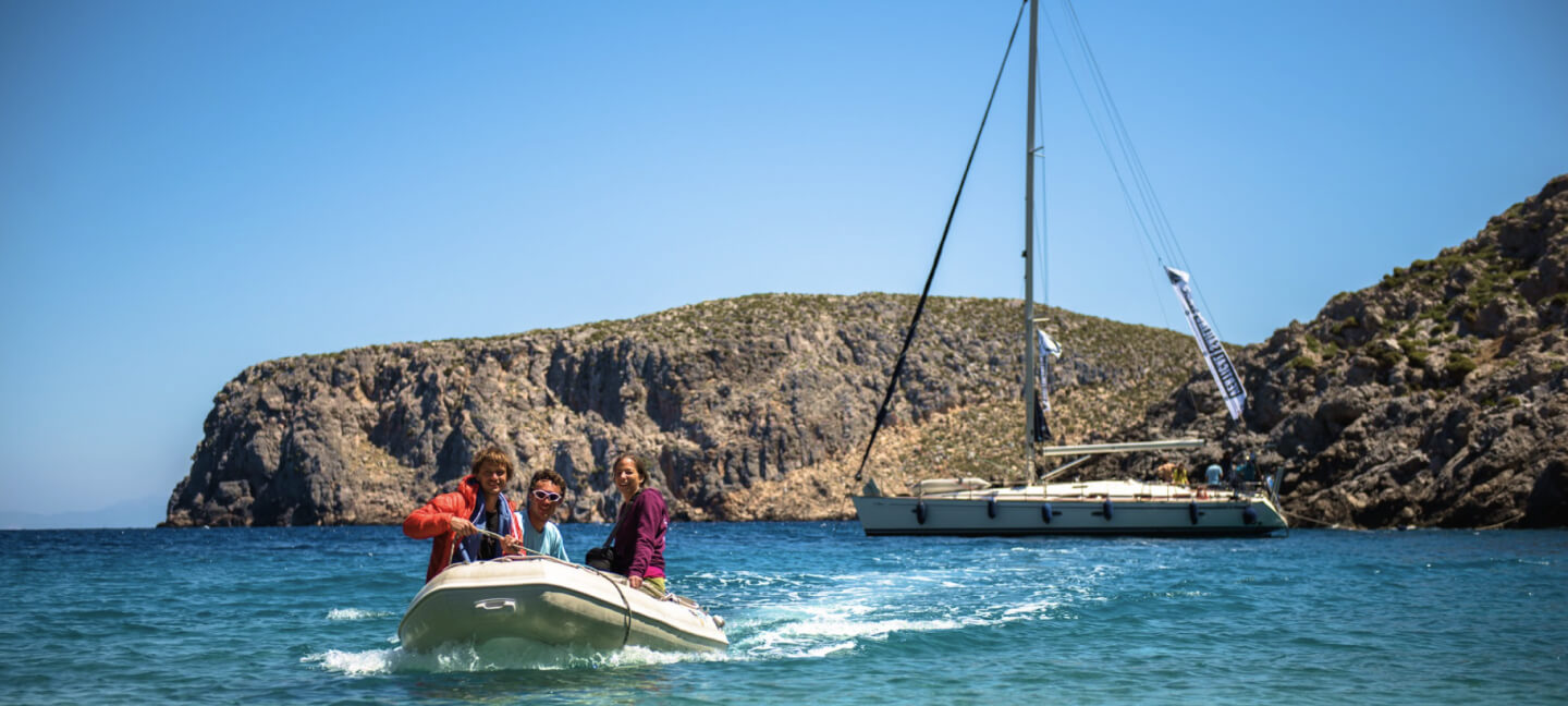 Experience the crystal clear sea of Sardinia on a boat.