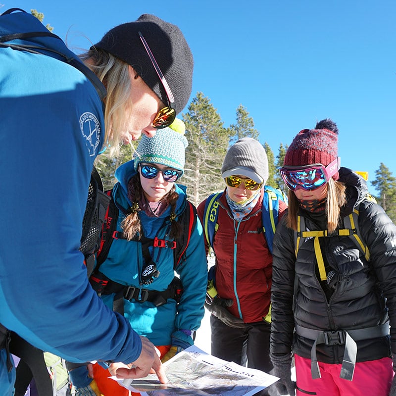 Students looking at a map in Estes Park