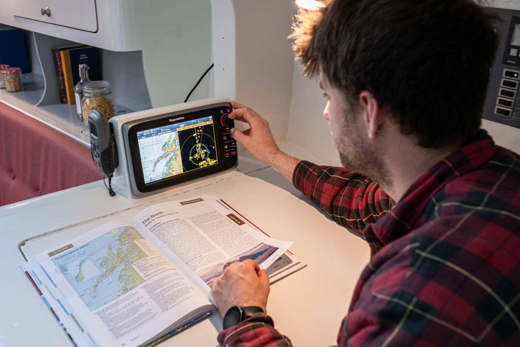 Tour guide looking at maps and picking the best ski spots for the day