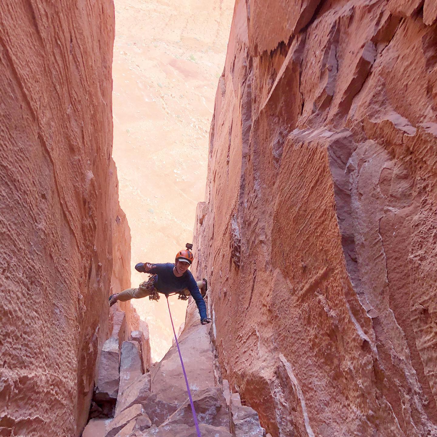 Rock climber practicing his movement in Moab