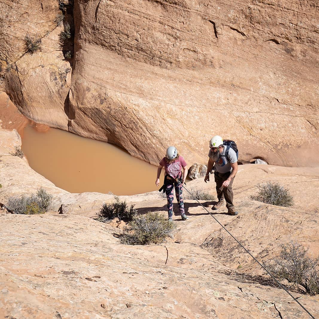 A climber canyoneering in Moab