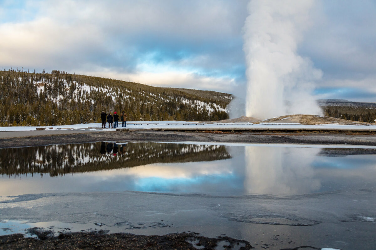 Old Faithful and onlookers in Yellowstone