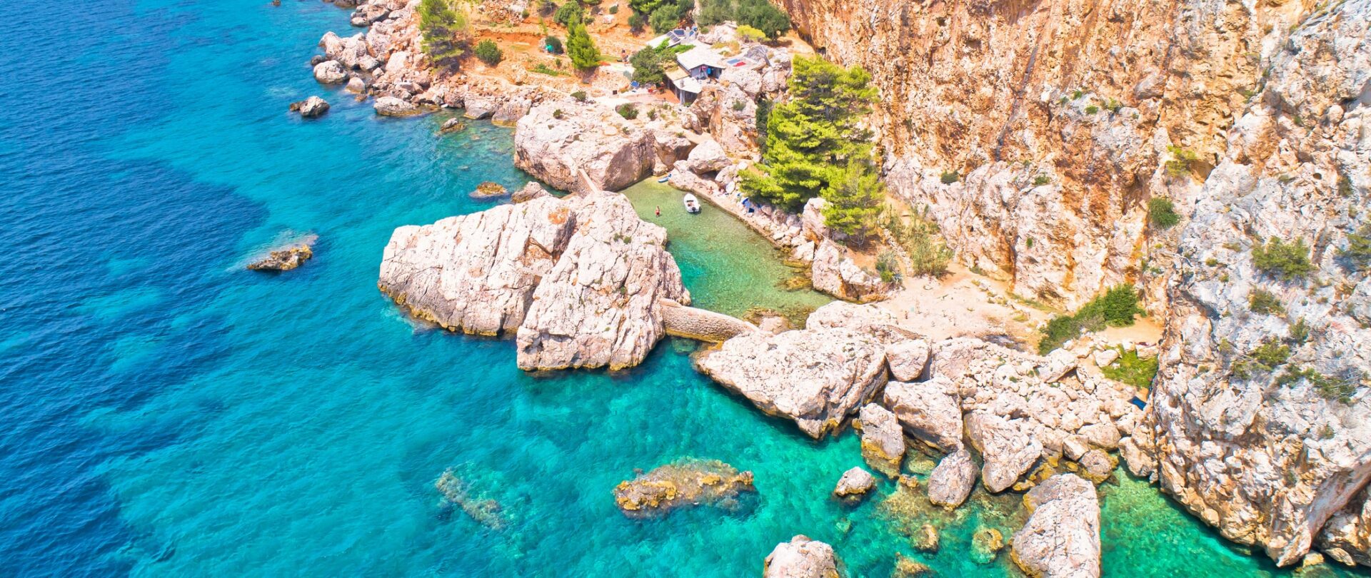 Amazing cliffside beach near Sveta Nedjelja on Hvar island aerial view, Dalmatia archipelago of Croatia