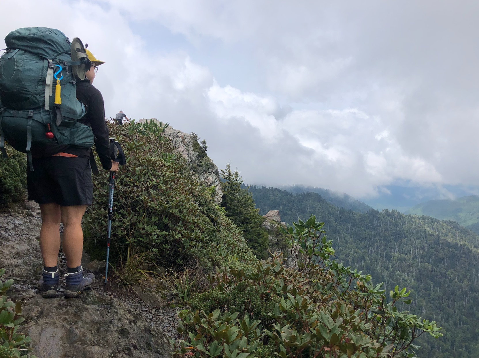 A hiker overlooking a valley in Smoky Mountains National Park