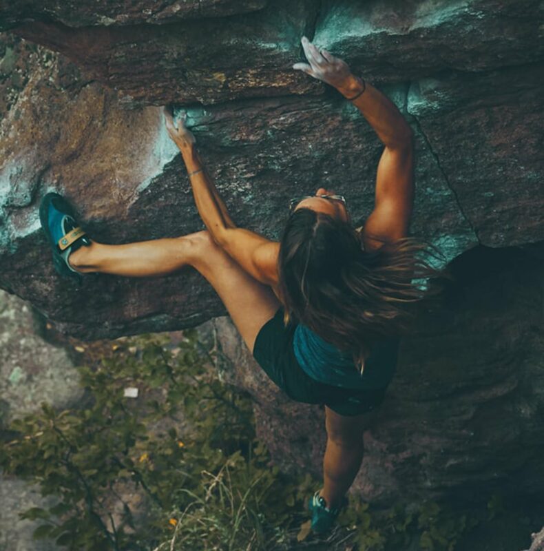 A woman climbing in Red River Gorge