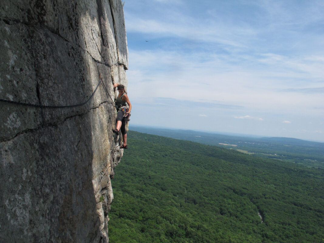 A woman climbing in the Gunks