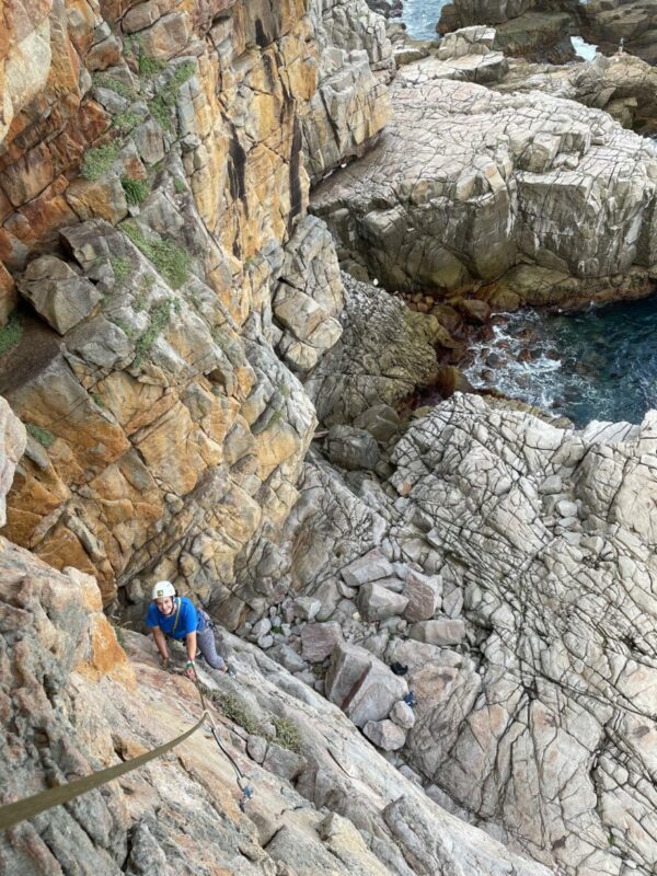 A woman on the crags of Long Dong in Taiwan