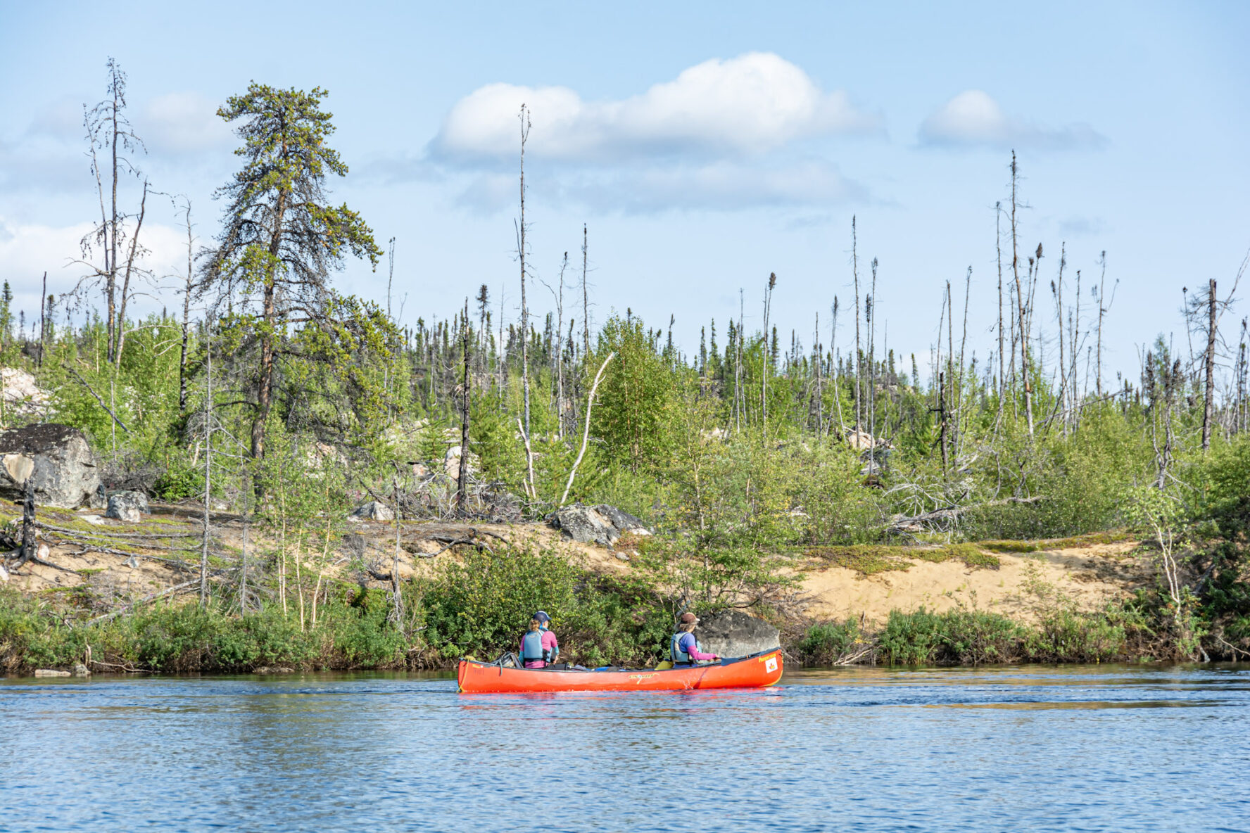 Canoers taking in the views from the Seal River in Manitoba