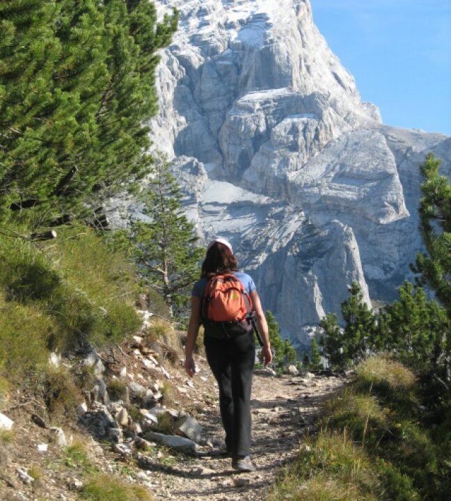 A woman hiking on the Alta Via I trek route.