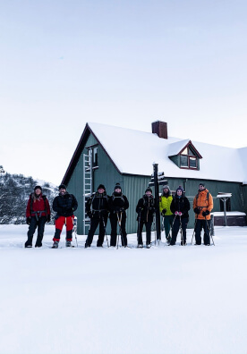A hiking group preparing for the challenging winter hike in Iceland.